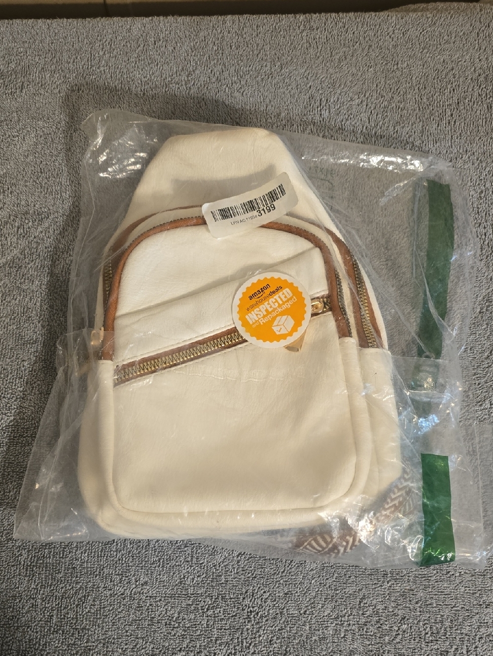 Cream Sling Bag with Gold Zipper and Tan Trim